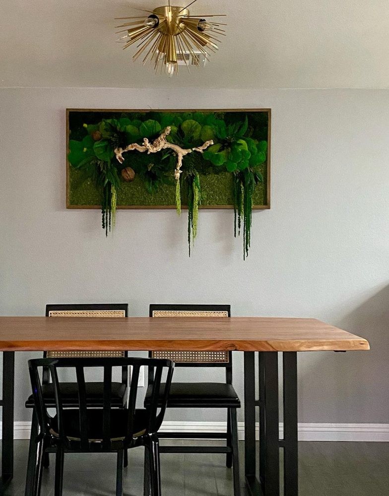 Custom moss wall art installed in a dining room